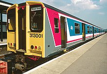 The first Class 313 unit, 313001, in the late 1980s at Watford Junction in Network SouthEast livery 313 Original NSE livery.jpg