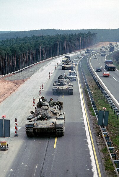 File:3rd Armored Division M60A3 tanks and armored personnel carriers near the Sembach Air Base exit ramp DF-ST-83-05568.jpg