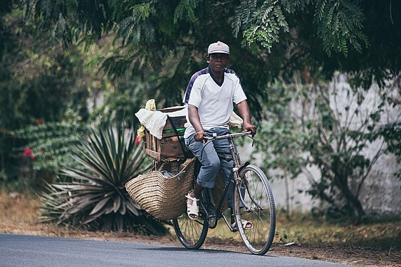 A bicycle delivery guy in diani kenya by Emmaculate jacobine