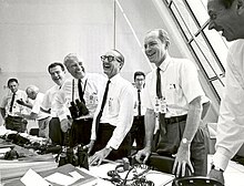 Charles W. Mathews, von Braun, George Mueller, and Lt.-Gen. Samuel C. Phillips in the Launch Control Center following the successful Apollo 11 liftoff on 16 July 1969