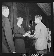 At the White House, Mrs. Roosevelt was presented with a bouquet by one of the students