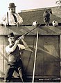 Scene from "Oh! Daddy!", featuring Billy Bevan (bottom) and Mildred June, 1922