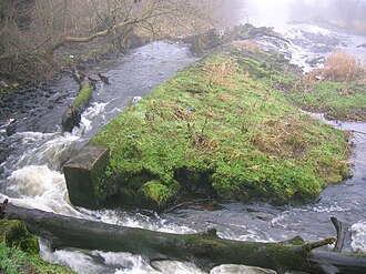 The old Bridgend Mill weir, once the possession of Kilwinning Abbey Bridgend weir on the Garnock.JPG