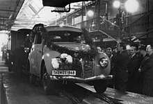 In November 1948 the first Ford Taunus G73A emerged from Ford's Cologne factory. The celebratory garland does not conceal the fact that very little distinguished the 1948 Taunus G73A from the prewar Taunus G93A Bundesarchiv Bild 183-2005-0722-512, Koln, Erster Ford Taunus lauft vom Fliessband..jpg