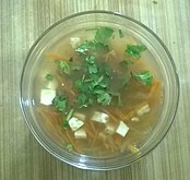 A broth-style carrot-papaya soup prepared using julienned carrots