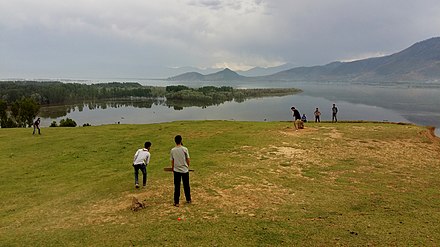 Kashmiri youth playing cricket at Wular Lake, Bandipora district, Jammu and Kashmir. CRIC.jpg