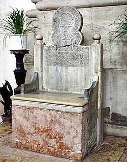 Saint Peter's Chair, the oldest throne of the diocese of Venice in the co-cathedral of Saint Peter of Castello. It is likely an ancient Muslim gravestone transported from Antioch by merchants. Cattedra di San Pietro in San Pietro di Castello (Venice).jpg
