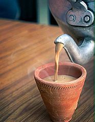 Image 2Indian Masala chai served in a red clay tea cup. (from List of national drinks)