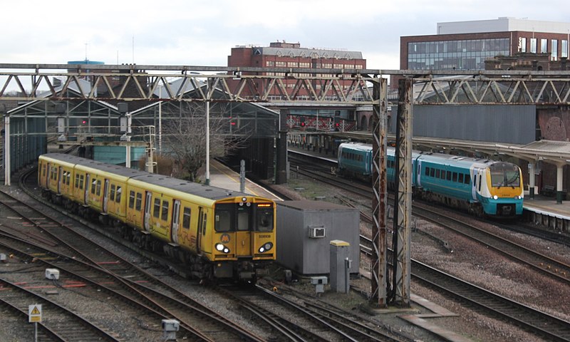 File:Chester - Merseyrail 508108 and Keolis Amey 175109.JPG