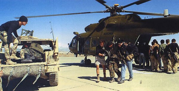 U.S. special forces help Afghan troops away from a CIA-operated Mil Mi-17 Hip helicopter at Bagram Airbase