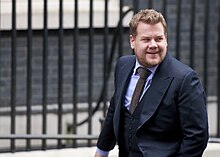 Corden arriving at 10 Downing Street to interview then British Prime Minister David Cameron in March 2014 Comedian James Corden arrives at Number 10 Downing Street to interview Prime Minister David Cameron (15601005146).jpg