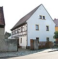 Former farmhouse with gate pillars and fencing