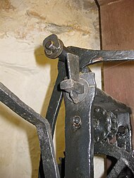 The top of the frame with the bell lever Cotehele clock 02.jpg