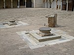 Sundial and wells in the courtyard