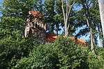 English: Lutheran church in Dźwierzuty and cemetery nearby. Polski: Kościół ewangelicki we wsi Dźwierzuty oraz pobliski cmetarz.