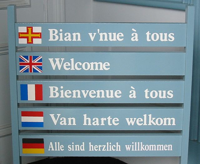 Guernésiais tops this list of welcome messages at Guernsey's tourism office in Saint Peter Port