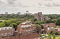 Diemen. Uitzicht vanaf woontoren 5 aan het Berkenplein over de huizen van Diemen naar de ArenA in Amsterdam.