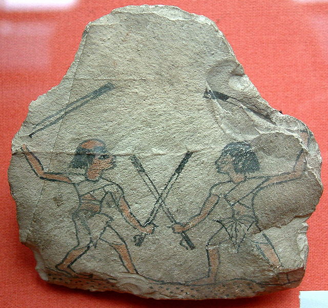 Image of two ancient Egyptian men practicing tahtib on an ostracon