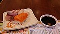 Four selection of sashimi plates and soy sauce and wasabi.jpg