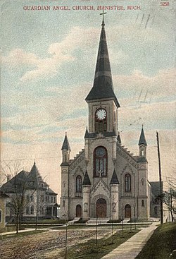 Colorized photograph of a church with tall spire.