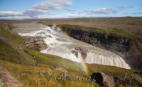 Rainbow over Gullfoss ("Golden Falls" in Icelandic), a waterfall located in the canyon of the Hvítá river and one of the main attractions of the Golden Circle in southwest of Iceland. The fall step on the left is 11 m high and the one on the right 20 m high. The amount of water flowing is in summer, when the picture was taken, 140 m3/s.