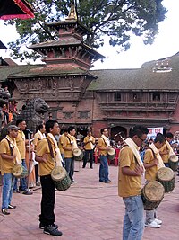 Possible Naya-Khin drums and chhusya cymbals at performance of Gunla Bajan religious music at Kathmandu Durbar Square. Gunla bajan performance.jpg