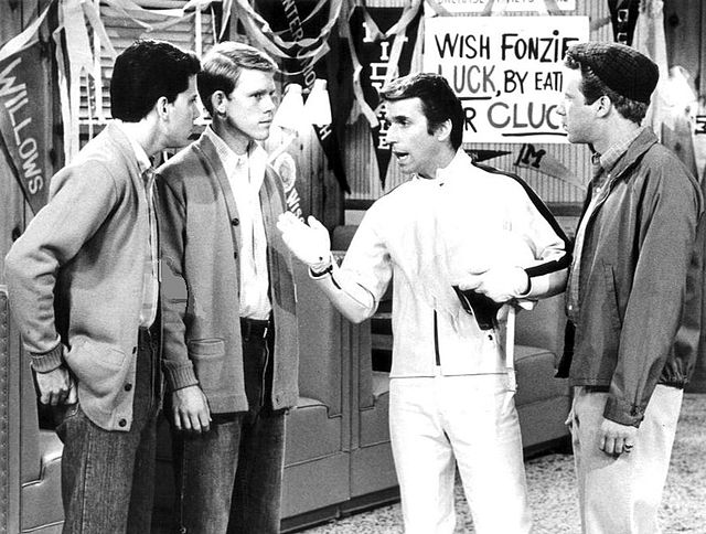 Potsie (Anson Williams), Richie (Ron Howard), Fonzie (Henry Winkler) and Ralph Malph (Donny Most) at Arnold's drive-in.