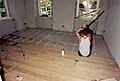 denkmalgerechte Sanierung mit Kalkputz und Eiche Massivholzdielen auf sanierter original Balkenlage im Obergeschoss (1992)