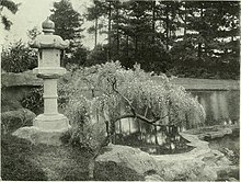 Stone lantern and dwarf wistaria at Friar Park, Henley-on-Thames (c. 1899, by Frank Crisp) Japanese stone lantern and dwarf wistaria at Friar Park, Henley-on-Thames-14777963305.jpg