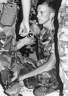 Marine Corporal Jeff Paterson refused to board military aircraft in Hawaii en route to Persian Gulf on August 7, 1990. Jeff Paterson Refusing to Board Aircraft to Persian Gulf 1990.jpg