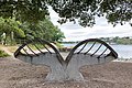 Leaf-shaped steel bench with oak seats overlooking the River Plym at Saltram, Plymouth