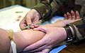 Image:Medic_Red_Stewart_performs_a_phlebotomy_at_a_JTF-GTMO_medical_clinic.jpg