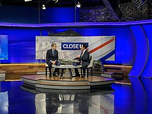 Adam Sexton (right) interviewing senator Michael Bennet during the 2020 presidential election. Michael Bennet on WMUR.jpg