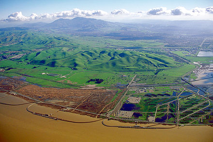Aerial view of the Los Medanos foothills and Mount Diablo from over Suisun Bay at Concord, California