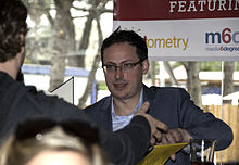 Silver signing a copy of The Signal and the Noise at SXSW 2013 Nate Silver at SXSW 2013.jpg