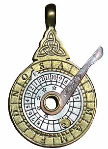 A nocturnal as costume jewellery. This is a functioning nocturnal, though only about 5 cm tall. It shows the month ring on the outside in brass. The silver coloured inner disk shows the time and has an indicator on one edge. By setting the indicator to the month and day (in this case, a few days into October), centring Polaris in the hole in the middle and rotating the pointer attached to the centre to a specified circumpolar star, the arm indicates the time (in this case, 8 pm). Nocturnal (instrument).jpg