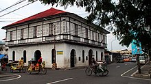 Pedicabs or pedal cabs crossing a street near Manalang Gloria Ancestral House Pedalcabs crossing near Manalang House in Tabaco City.jpg