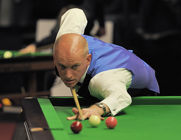 Peter Ebdon defeated the defending champion Ronnie O'Sullivan 13–11