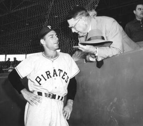 Rickey speaks with young shortstop Dick Groat in 1955, his final year as general manager of the Pirates