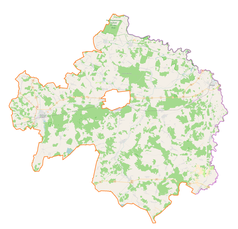 Mapa konturowa powiatu bialskiego, blisko centrum na dole znajduje się punkt z opisem „Łomazy”