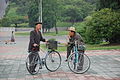 Two men with bicycles, Pyongyang, 2016