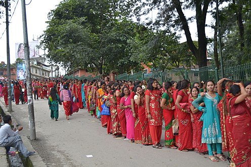 Women line up to making offerings to Parvati and Shiva at Pashupatinath Temple