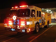 An American fire engine lit up at night. Notice the use of lights and reflective markings on the vehicle. RE23night1.jpg