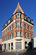 Corner apartment building with shop