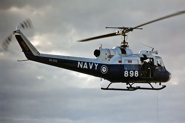 A RAN Bell UH-1B Huey VH-NVV hovering at NAS Nowra in January 1996 on the occasion of the 1996 Air Day at HMAS Albatross.