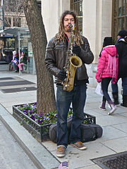Saxophone player with light brown dreadlocks at Inauguration 2013.jpg