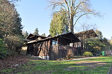 A number of modest, rustic cottages by Ellsworth Storey survive near Colman Park on the Lake Washington shore. Their Seattle Landmark status and recognition on the National Register of Historic Places has improved their chances of remaining in a neighborhood where few such modest residences remain. Seattle - Ellsworth Storey Cottages 07.jpg