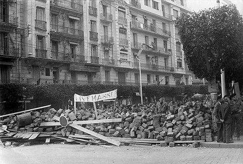 Supporters of General Jacques Massu set barricades in Algiers in January 1960