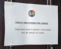 A sign outside a toilet cubicle in the Duke of Wellington gay bar in Soho which explains that it is one person per cubicle. Single person notice.jpg