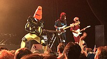 TWRP (from left to right: band members Doctor Sung, Commander Meouch and Lord Phobos) became Ninja Sex Party's backup band in 2015. TWRP Dallas Bomb Factory 2018 (cropped).jpg